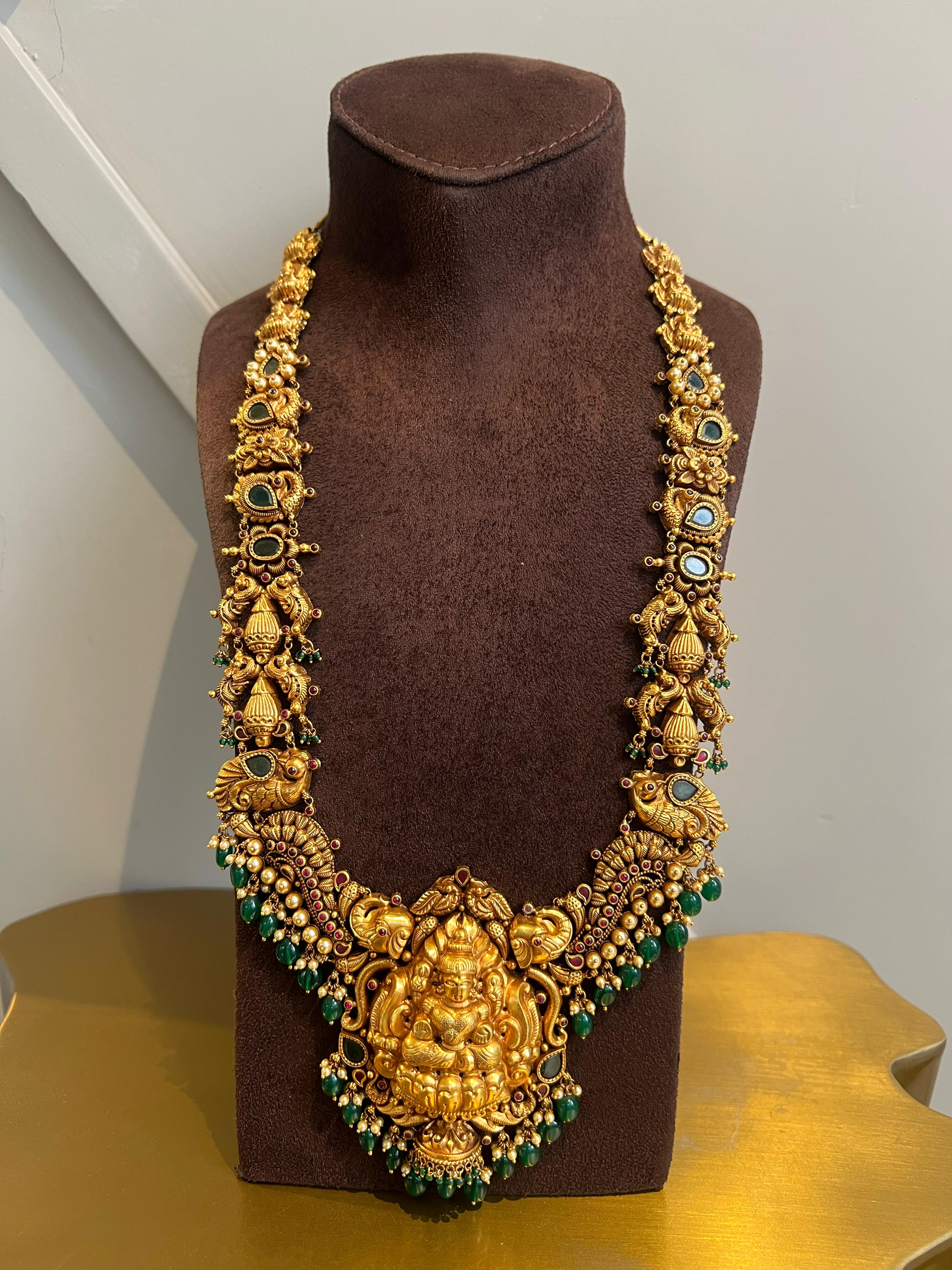 Antique gold haram with laxmi motif Antique gold haram with laxmi motif