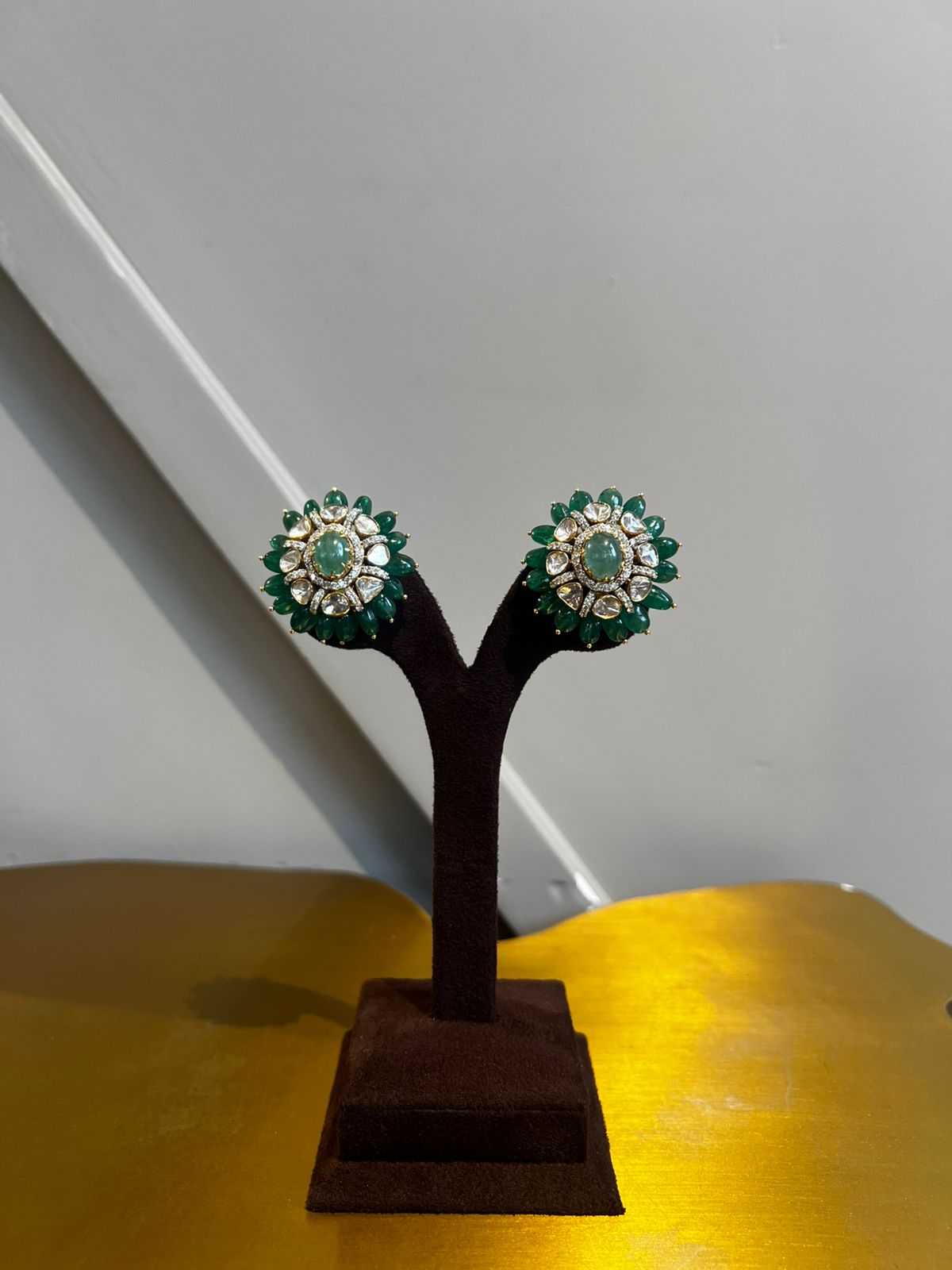 Beautiful Polki earrings studded with Emerald