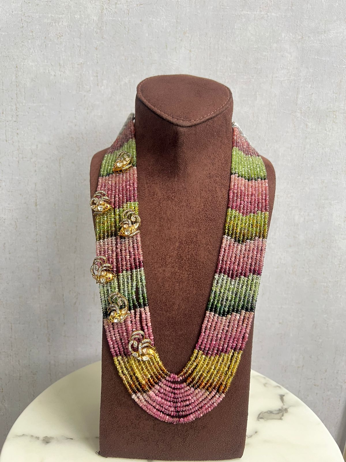 Multi colored tourmaline beads with side fish motif